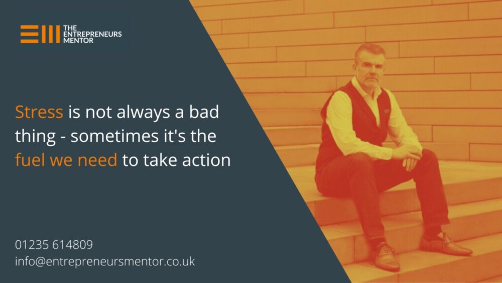 Mike Foster, the entrepreneurs mentor, sitting on outdoor steps, looking reflective