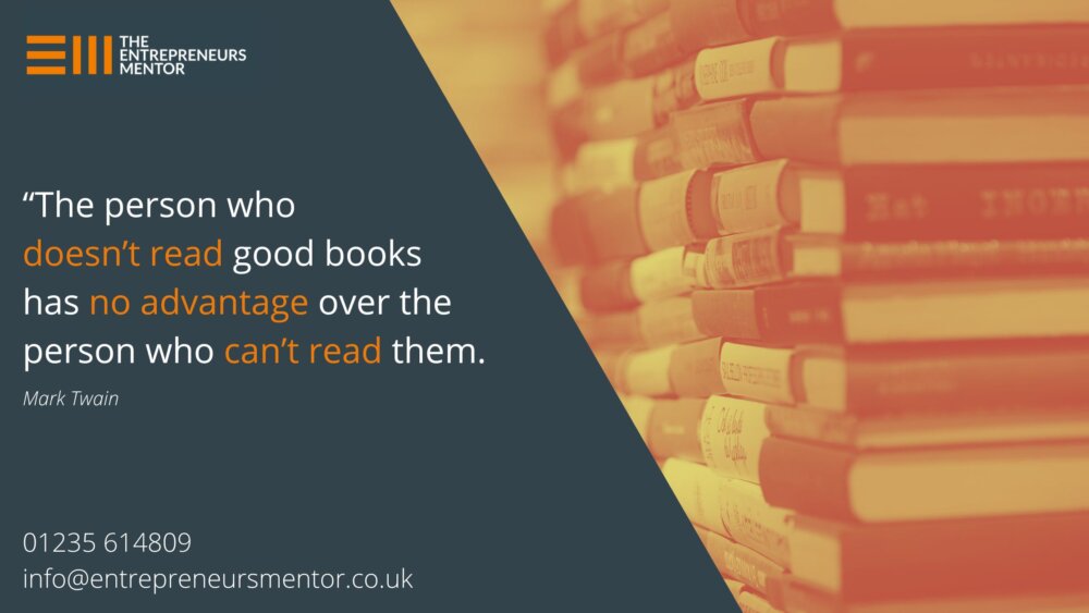 A tall pile of book spines